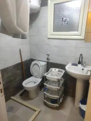 a bathroom with a toilet and a sink at Sheraton Plaza in Hurghada