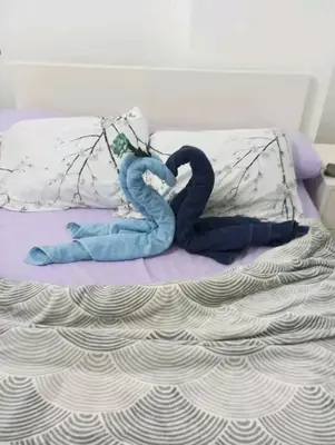 a stuffed animal is laying on a bed at Sheraton Plaza in Hurghada