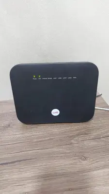 a black laptop computer sitting on top of a wooden floor at الغردقة منطقه عربيا شارع العشريني بجوار كافية فيلو in Hurghada