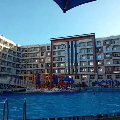 a large swimming pool in front of a building at Golden Tiba in Hurghada