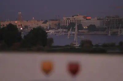 a view of a city at night with a harbor at King Nile Luxor in Luxor