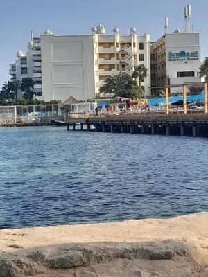 a pier over a body of water with buildings at 3-Bed Sleeps 6 with Sea View & Free Parking in Hurghada