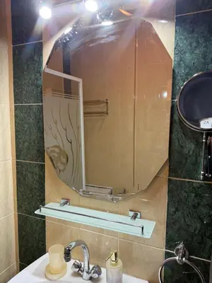 a bathroom with a mirror and a sink at Casa Hurghada in Hurghada