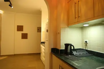 a kitchen with a counter and a telephone on a counter top at Casa Hurghada in Hurghada