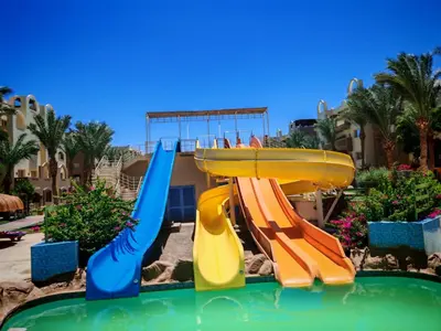 a water slide in a pool at a resort at Studio in Nubia Aqua Beach Twin Room in Hurghada in Hurghada