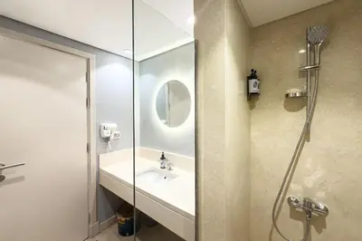 a bathroom with a sink and a shower at The Platinum Perch 2BDR Pool View Free Pool & Beach Access in Hurghada