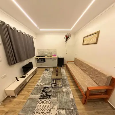 a living room with a couch and a table at Celia Guest House in Luxor