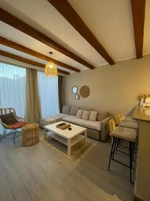 a living room with a couch and a table at One Bedroom private pool in Hurghada