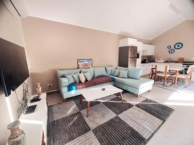 a living room with a couch and a table at Two Bedroom with Private pool in Hurghada