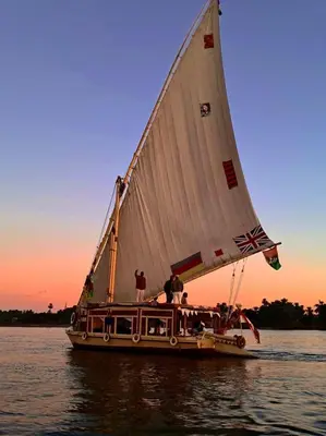 a group of people on a sail boat on the water at Traditional Felucca Sailing Boat Overnight in Aswan