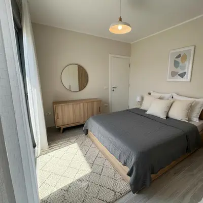 a bedroom with a large bed and a mirror at one Bedroom with Private pool in Hurghada