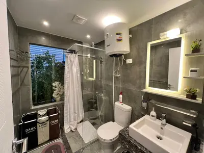 a bathroom with a toilet and a sink and a shower at one Bedroom with Private pool in Hurghada