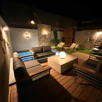 a living room with a couch and a table at one Bedroom with Private pool in Hurghada