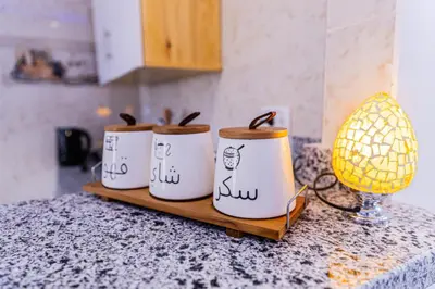 a group of four coffee cups sitting on a counter at Spacious and Chic 3 Bedroom Appartment Beautiful Rooftop Terrace Great location to explore Hurghada in Hurghada