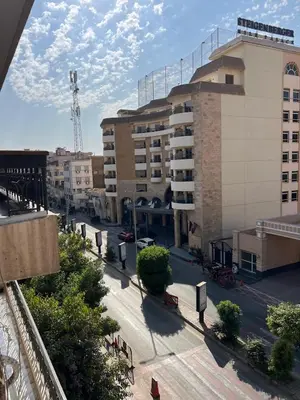 a view of a city street with a building at Nile View Luxe Stay , Walk to Luxor Temple in Luxor