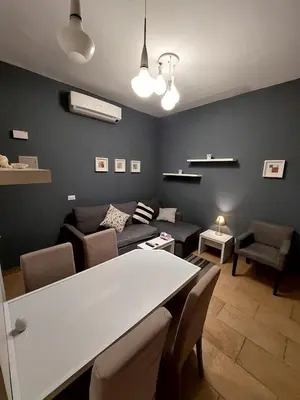 a living room with a couch and a table at Kite Lodging Hotel in Hurghada