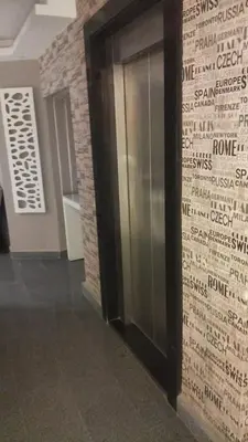 a elevator in a building with writing on the wall at Kite Lodging Hotel in Hurghada
