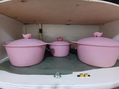 three pink pots sitting on top of a sink at Arrabia in front of Beirut Hotel in Hurghada