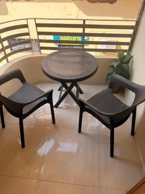 two chairs and a table and a table and chairs at Oscar apartment 5 in Luxor