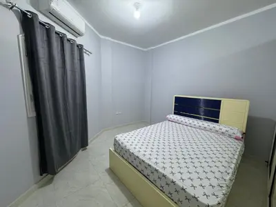 a small bedroom with a bed in a room at Peace Homes in Quseir