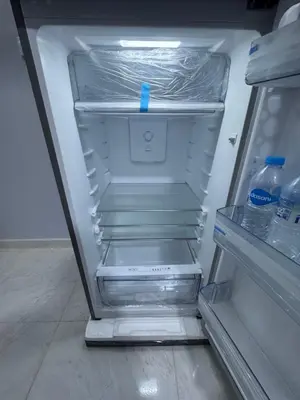 an empty refrigerator with drinks and water bottles in it at Peace Homes in Quseir