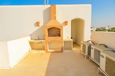 a room with a brick fireplace on a roof at Breathtaking Villa in El Gouna 15 in Hurghada