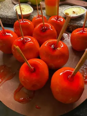 a bunch of red tomatoes with wooden sticks in sauce at فندق ميراج باي اكوا بارك in Hurghada
