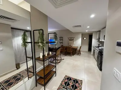 a kitchen and dining room with a table and chairs at M10-2b-04 mangrove in Hurghada
