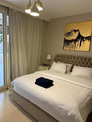 a bedroom with a bed with a blue towel on it at M10-2b-04 mangrove in Hurghada