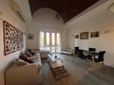 a living room with a couch and a table at Cozy South Marina 2Bdr with Pool Access in Hurghada