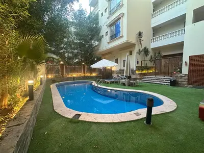 a swimming pool in the yard of a house at Interstar Luxury Apartments in Hurghada