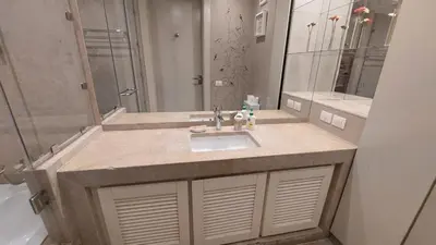 a bathroom with a sink and a large mirror at Scenic Cosy Nest - Infinity Pool - Ancient Sands in Hurghada
