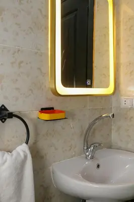 a bathroom with a sink and a mirror at Luxury Arabic Romantic Studio with its own large private Roof Terrace 15 mins from El Gouna in Hurghada