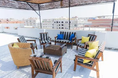 a group of chairs sitting on top of a roof at Luxury Arabic Romantic Studio with its own large private Roof Terrace 15 mins from El Gouna in Hurghada
