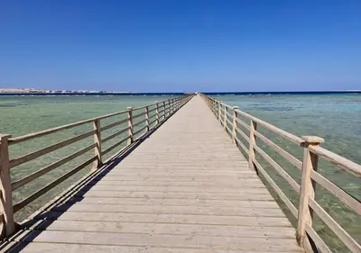 a wooden pier stretches out into the water at studio in Hotel Gravity 5 stelle in Hurghada