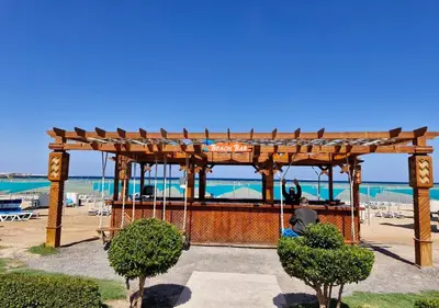 a man on a swing at the beach at studio in Hotel Gravity 5 stelle in Hurghada