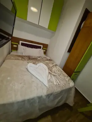a bedroom with a bed with a heart on it at ElGouna west golf 2 bedrooms 2 bathrooms - pool in Hurghada