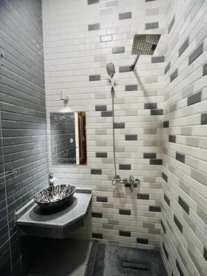 a bathroom with a sink and a shower at Twins Villa Luxor in Luxor