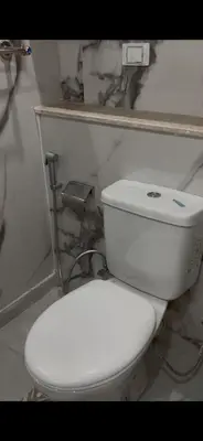 a bathroom with a white toilet in a room at غرفه فندقيه in Hurghada