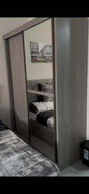 a mirror reflection of a bed in a bedroom at غرفه فندقيه in Hurghada