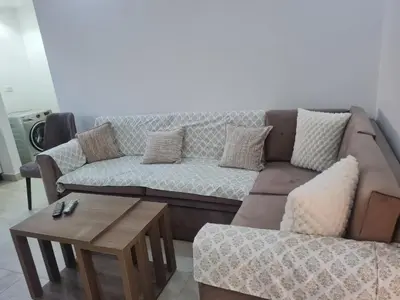 a living room with a couch and a coffee table at Mirage Bay Resort & Aqua Park in Hurghada