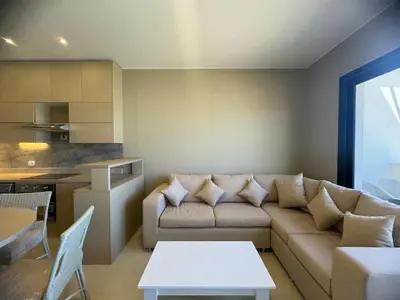 a living room with a couch and a table at 3 bedrooms penthouse with sea view in Hurghada