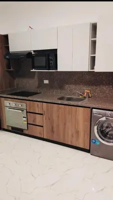a kitchen with a sink and a stove at La prestigia Hurghada Apartment by Hurghada Concierge in Hurghada