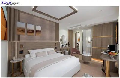 a bedroom with a large white bed in a room at Sola Dahabiya Nile Cruise Every Monday from Luxor to Aswan 4 nights and Every Friday from Aswan to Luxor 3 nights in Luxor