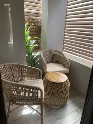 two wicker chairs and a table in a room at Bali - Elgouna Two Bedrooms private Heated pool in Hurghada