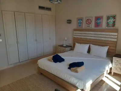 a bedroom with a bed with two towels on it at Modern Marina View 2 beds apt -New Marina-El Gouna in Hurghada