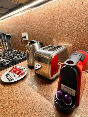 a toaster sitting on a counter next to a stove at Boho 2-BDR Haven in Makadi Heights - By Kemetland in Hurghada