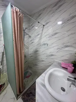a bathroom with a sink and a shower at Turtles Beach Resort Al-Ahyaa in Hurghada