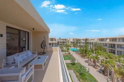 an apartment balcony with a view of a resort at 2-Bedroom Penthouse in G-Cribs Gouna in Hurghada
