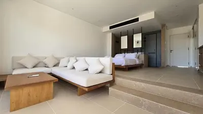 a living room with a white couch and a table at Modern Minimalist Beach & Pool Side Somabay Cabana in Hurghada